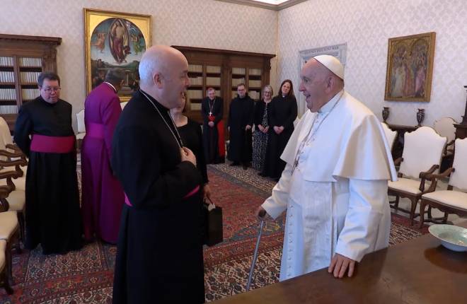 Archbishop Stephen is stood talking to the Pope
