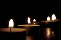 3 lit tealights with black background
