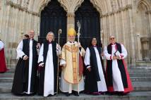 Archbishop Stephen stands on the steps of York Minster with the three newly consecrated bishops