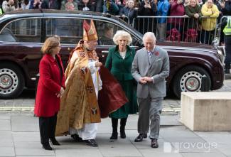 Archbishop in robes welcoming HM The King and Queen Consort to steps of York Minster