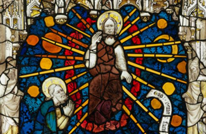 Close up of stained glass window showing God sitting in judgement